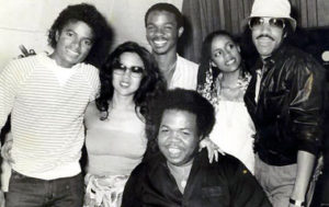 Pictured L to R behind Reggie Dozier: Michael Jackson, Susie Akita, unknown, Brenda Richie, and Lionel Richie